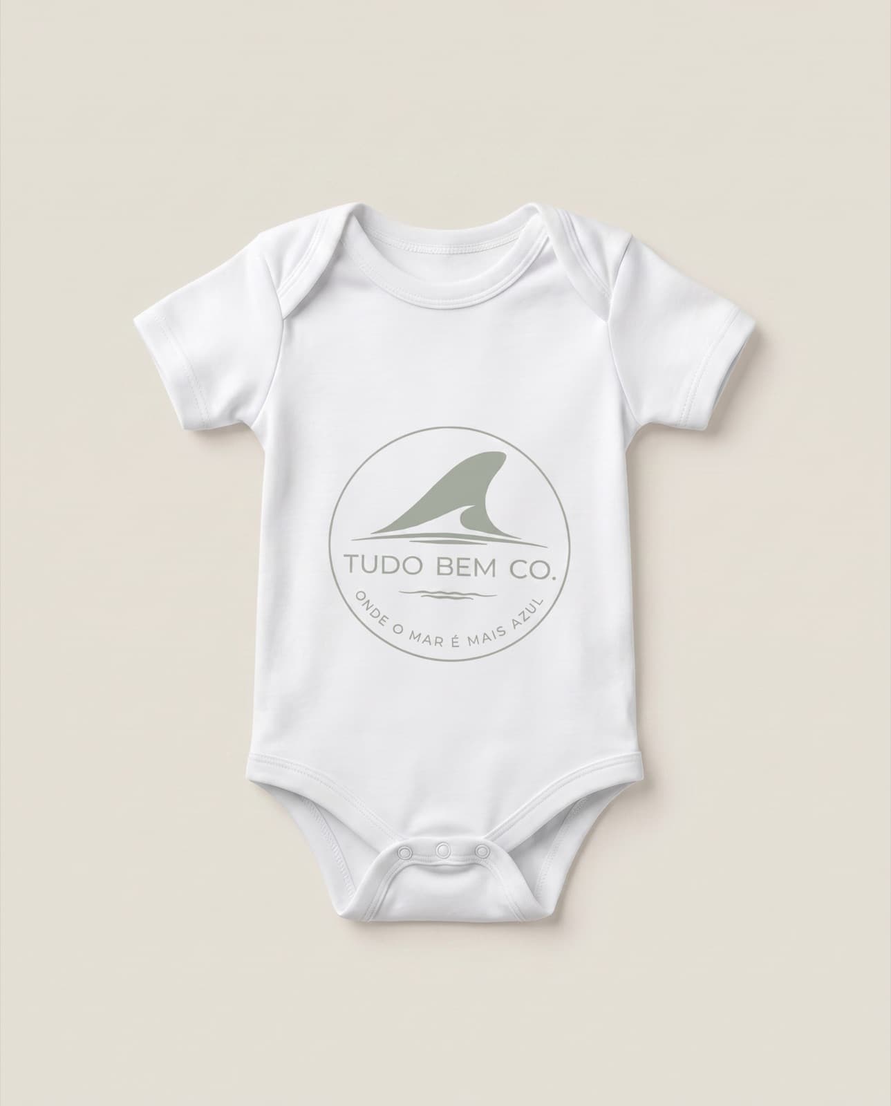 Tiny Tide baby bodysuit, front view on a soft neutral background
